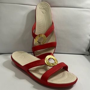 Tory Burch style Crocs in lipstick red with gold accent